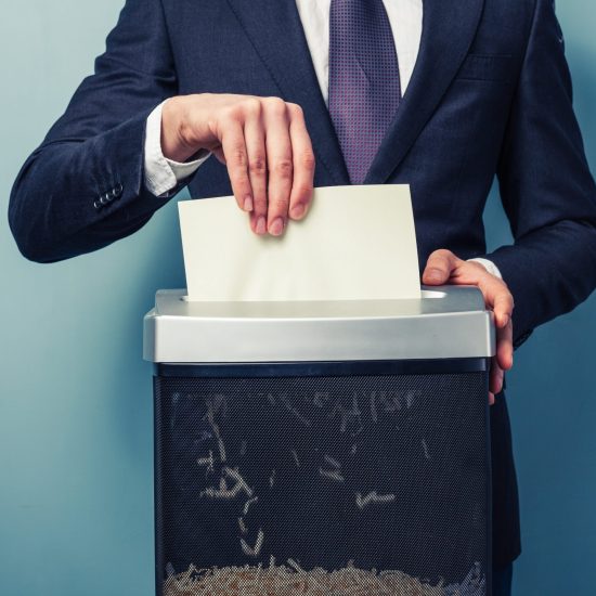 A,Businessman,Is,Shredding,Important,Documents