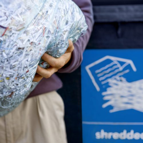 A,Man,Recycling,A,Bag,Of,Shredded,Paper A,Man,Recycling,A,Bag,Of,Shredded,Paper